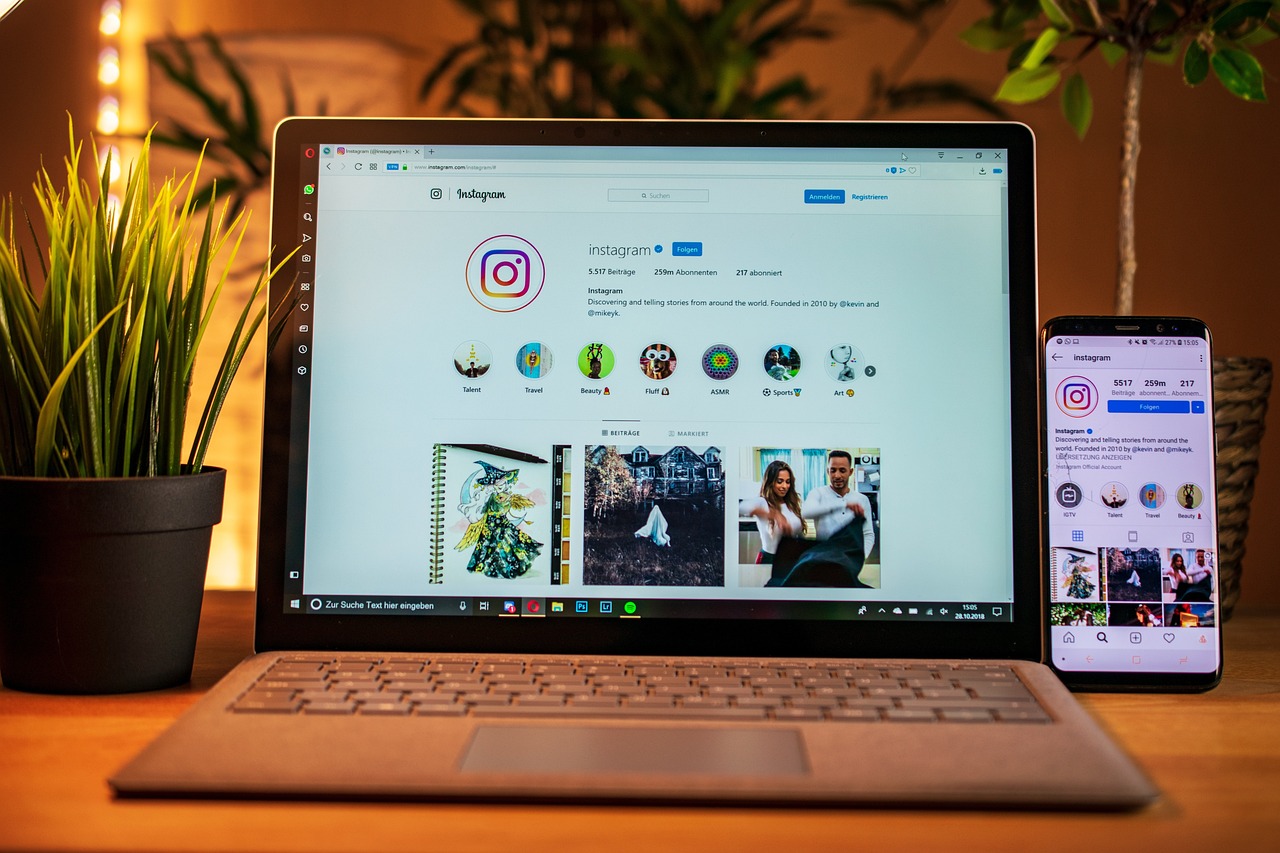 Instagram app on laptop and smartphone screen