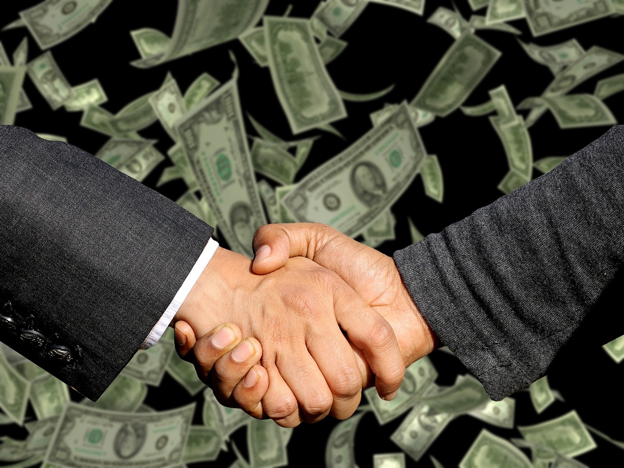 Business handshake and partnership agreement