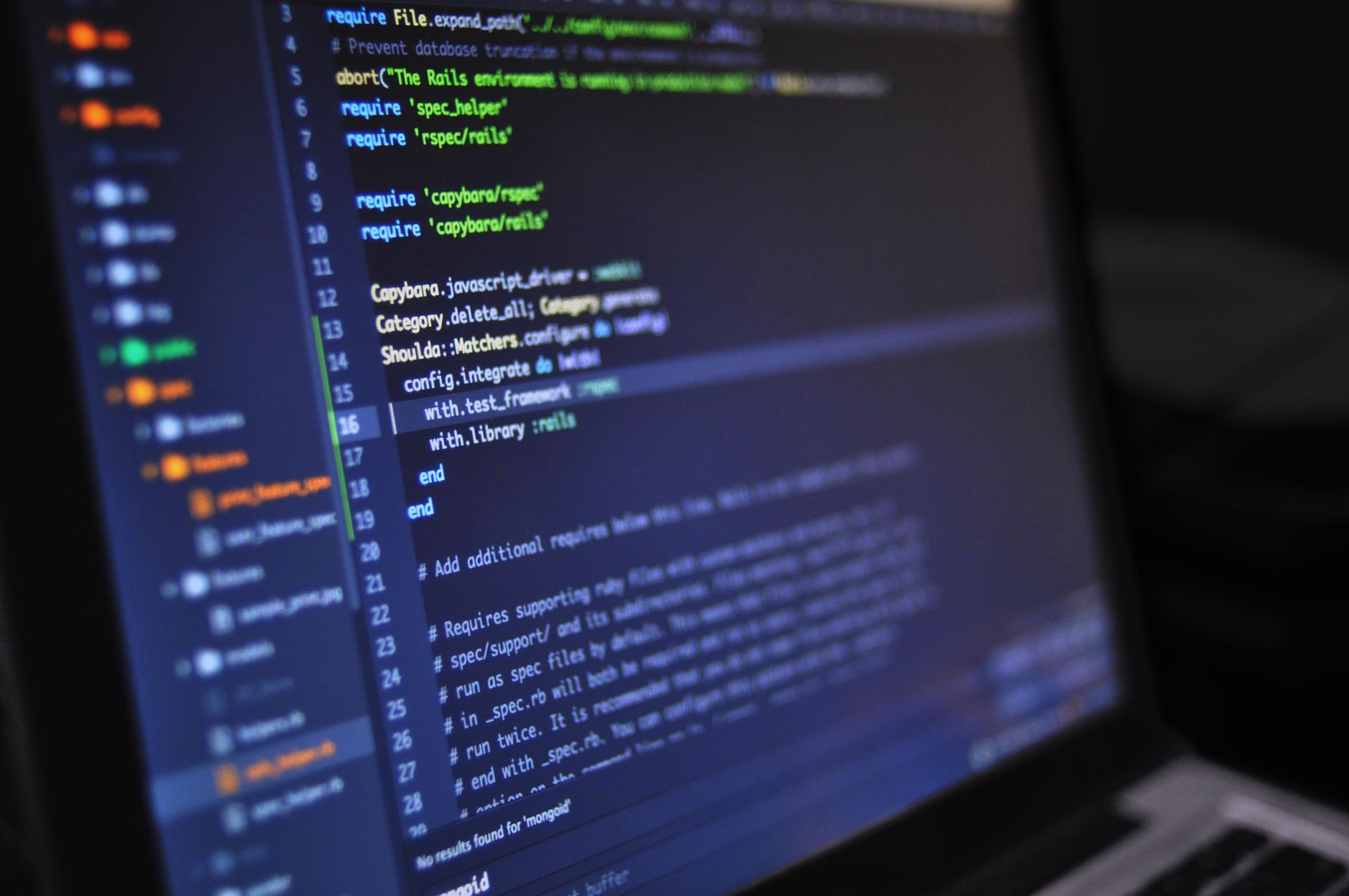 Software code displayed on laptop screen