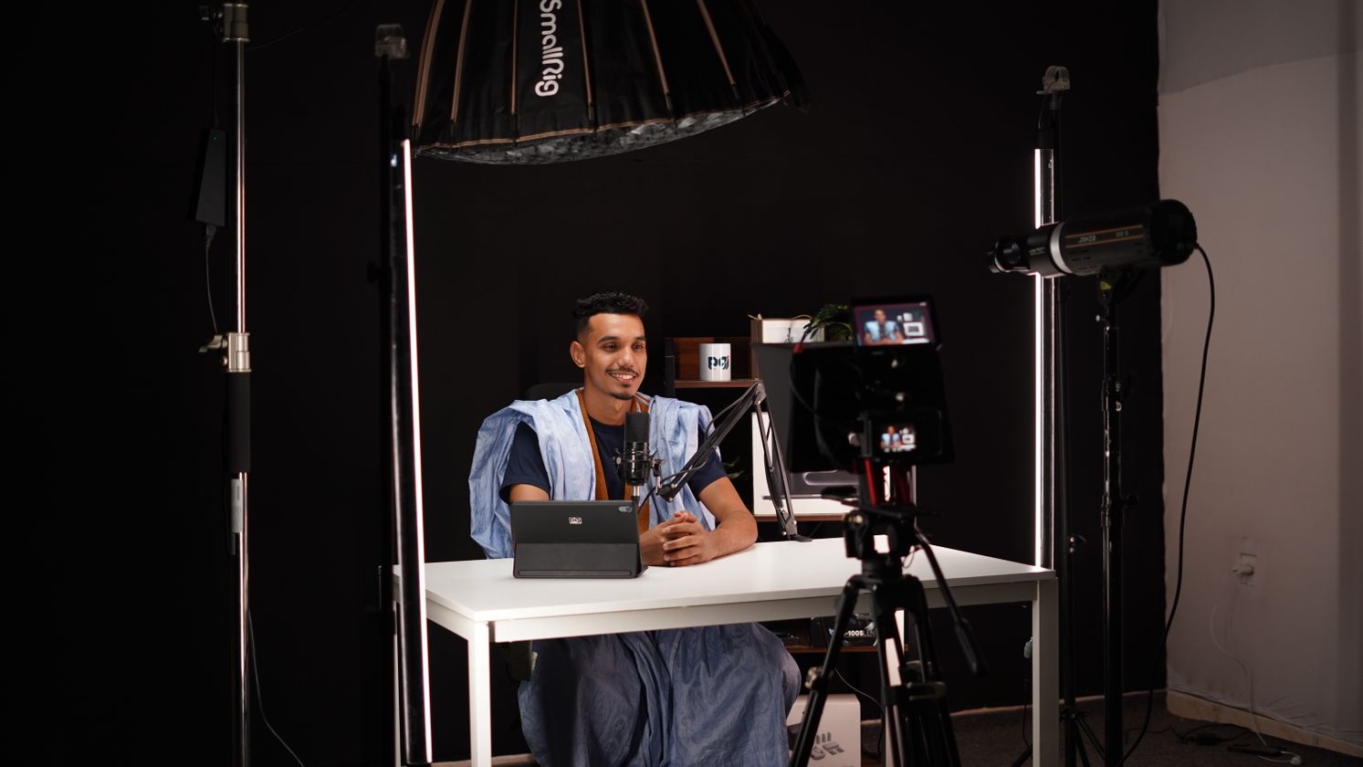 Creator recording a video with professional studio lighting